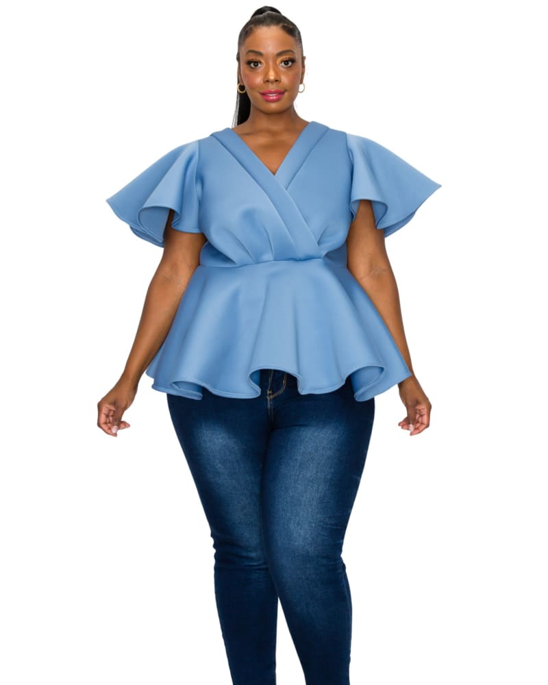 Front of a model wearing a size 2X Siobhan Peplum Top in Denim by L I V D. | dia_product_style_image_id:300486